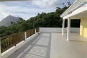 Quatre Bornes for rent is a huge, recently built villa with a breathtaking view, four bedrooms, an indoor pool and a garage.